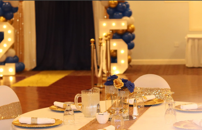  table place setting and the 2025 entrance lit behind